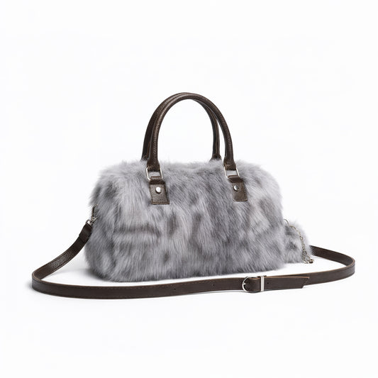 THE NEW SNOW LEOPARD DUFFLE BAG - WEAR SNOW ON YOUR WRIST NOT IN YOUR NOSE
